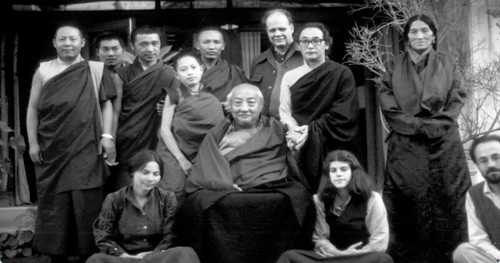 Dilgo Khyentse Rinpoche holding hands with Dagchen Sakya Rinpoche, Rabjam Rinpoche, Gene Smith, monks, women, photo from documentary on Gene Smith and the preservation of Tibetan books, Digital Dharma, http://www.lunchboxcity.com/