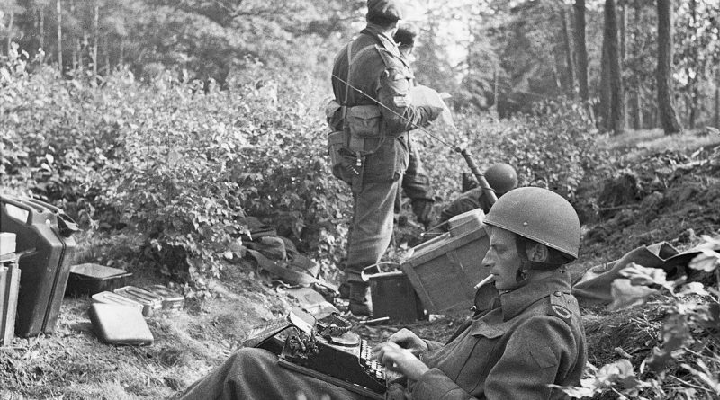 War correspondent typing his despatch.jpg